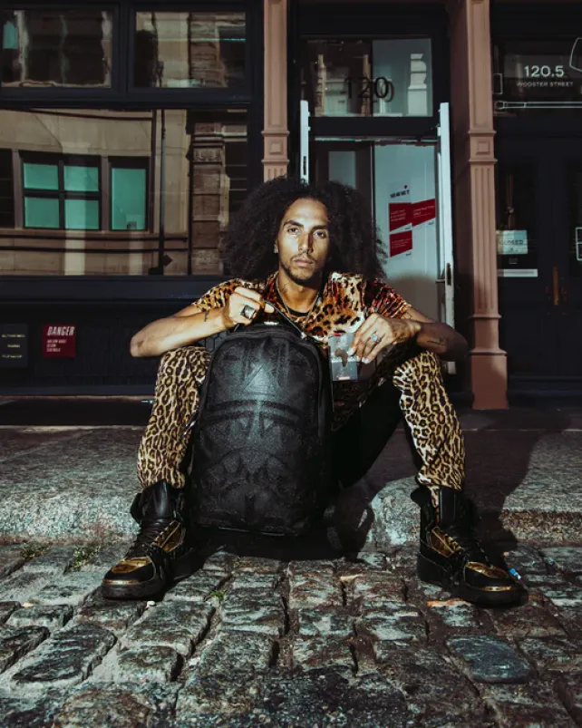 BACKPACKS>SPRAYGROUND AFRICAN INTELLIGENCE 9 APEX GENIUS BACKPACK - SANDFLOWER COLLAB