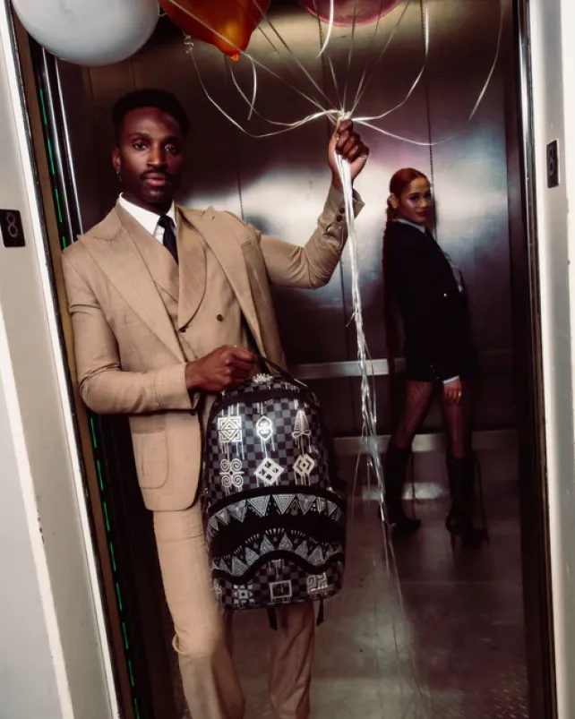 BACKPACKS>SPRAYGROUND AFRICAN INTELLIGENCE 9 POWER GLYPHICS BACKPACK - SANDFLOWER COLLAB