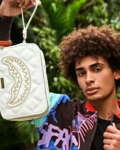 TOILETRIES AKA MONEY BAGS>SPRAYGROUND RIVIERA LE BLANC GOLD CHAIN SHARK TOILETRY BAG
