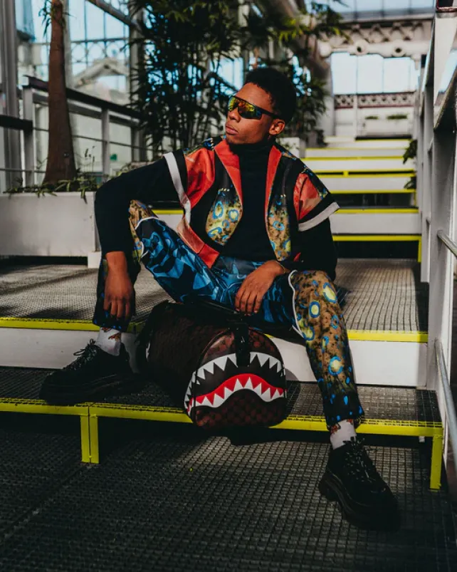 DUFFLES>SPRAYGROUND SHARKS AND SKULLS DUFFLE