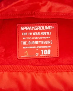 BACKPACKS>SPRAYGROUND THE 10 YEAR HUSTLE BACKPACK. MYSTERY BOX. NUMBERED 1 OF 100