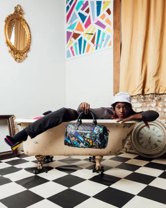 DUFFLES>SPRAYGROUND WTF ALIEN INVASION MINI DUFFLE